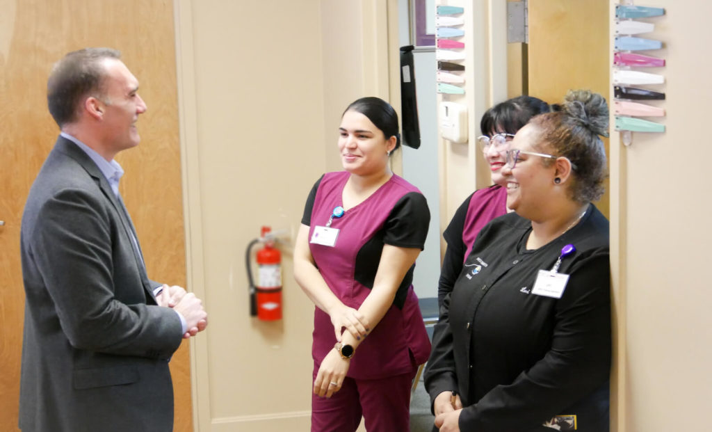 Dr. Colonna preps the team before they head out for the day.