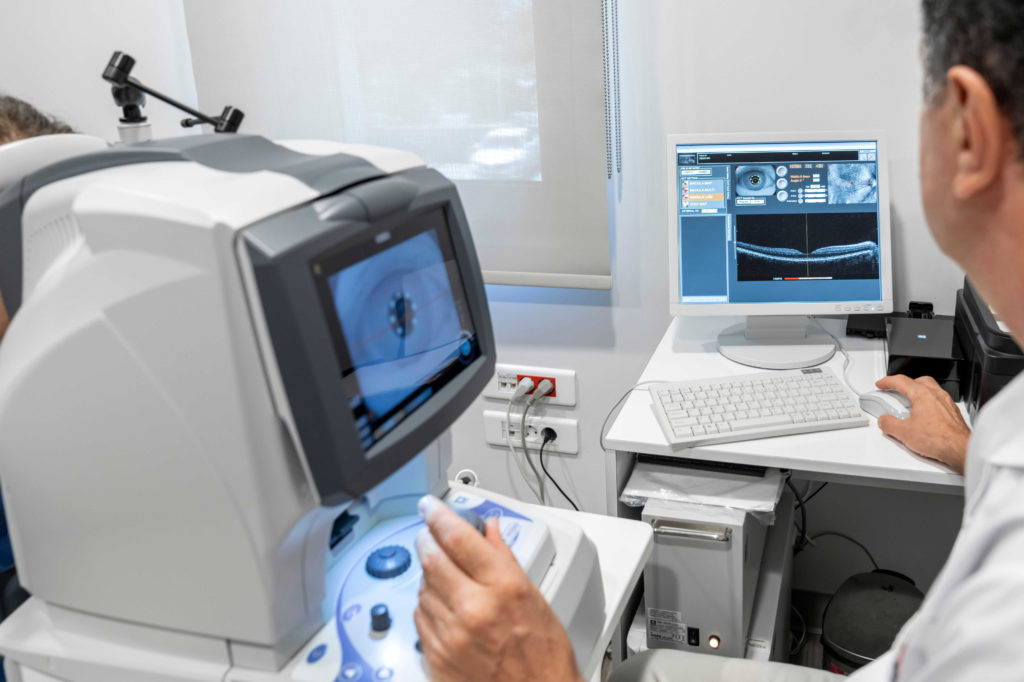 An optometrist using a phoropter.