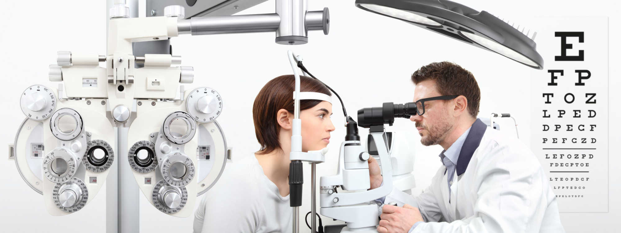 Image showing a female patient being examined with a slit lamp. Phoropter and eye chart also visible in the photo,